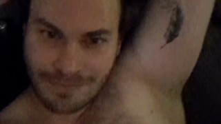 The furry bear behind the lady in red says hey