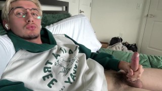 young gay twink jerks off in hoodie in bed