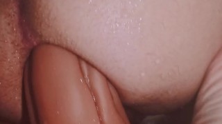 Young guy stretching his ass riding a giant dildo in the shower