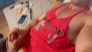 Laying on my favourite sofa and jerking off.