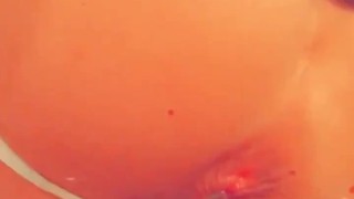 Two loads dripping out of jockstrap ass