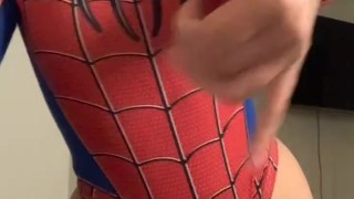 a beautiful girl in a spider-man costume