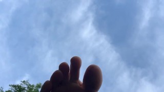 Redhead barefoot soles outside public