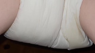 Diaper girl pees thick diaper