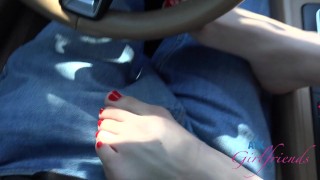 Angel Windell on vacation and jacks you off in the car and gives you a footjob