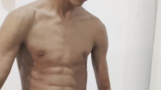 Young man with hard penis in his room while recording and touching his big dick