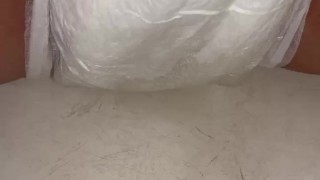 Babe fills up diaper with piss until it overflows out the side