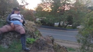 MILF with blue hair rubs wet pussy outside