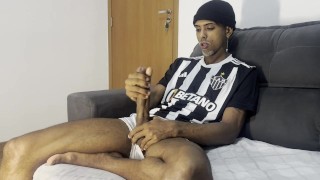 Masturbating his huge cock