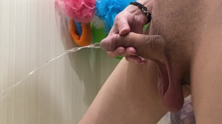 I pee in the bathtub with an uncut dick with big balls