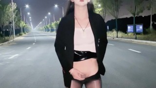 Chinese ladyboy masturbates and cums in the middle of the road