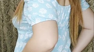 This redheaded girl looks very pretty in this blue dress.