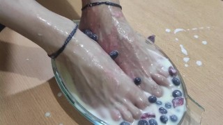 Amputee man fills his beautiful and skillful feet with cream, strawberry and blueberries for you