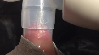 Milking milk with a breast pump to the last drop - close-up - Lactation - Milky tits