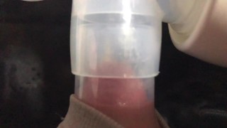 Milking milk with a breast pump to the last drop - close-up - Lactation - Milky tits