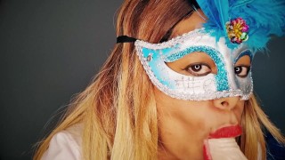 Masked milf sucks a dildo while looking into your eyes