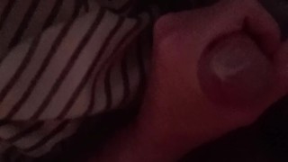 Playing with thick mushroom-headed cock in a tight condom