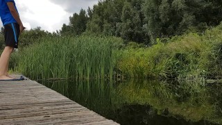 Guy pissing from a jetty