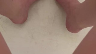 Babe pees in the tub and plays with feet