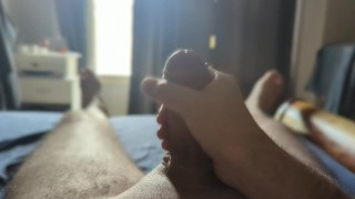 Masturbating with some sun rays through the window