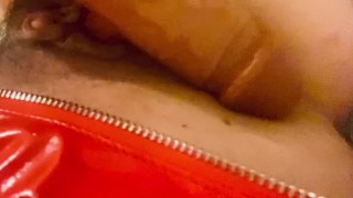 Red latex panties and a dildo