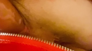 Red latex panties and a dildo
