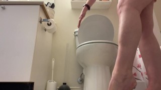 Girl peeing into toilet while standing up, trying to pee like a guy naked ass view girl standing pee
