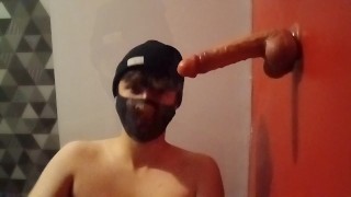 Handcuffed femboy suck a dildo with a chastity cage