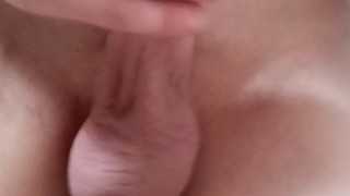 Stroking cock close up
