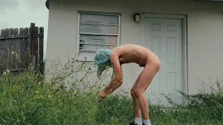 twink trimming the grass naked outside