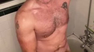 Beefy daddy fucks piss into another man’s ass