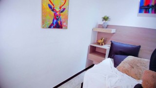 Beautiful redhead otaku masturbates on a chair while watching a fan jerk his cock on video call