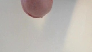 Natural uncut cock pissing on the morning thru the foreskin