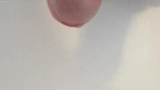 Natural uncut cock pissing on the morning thru the foreskin