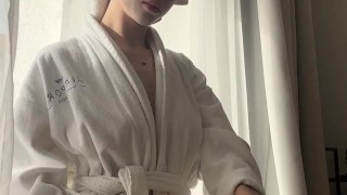 Diana rubs cream on her body