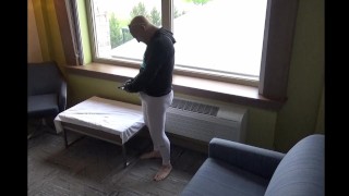 barefoot in leggings jerking off in cock sleeve at hotel window
