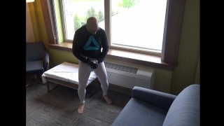 barefoot in leggings jerking off in cock sleeve at hotel window