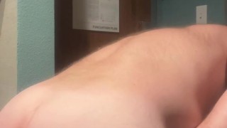 Sexy daddy bear Maxwell Cox strips out of his tiny g string and plays with his cock