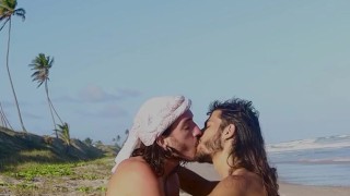 Deep tongue kiss at public nudist beach