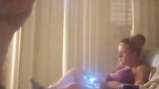Nasty roommate masturbating to pretty busty girl in bra and panties while she is playing video games
