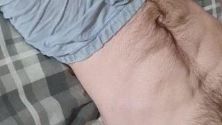 Teen wanks in bed watching porn and feeling dick over boxers