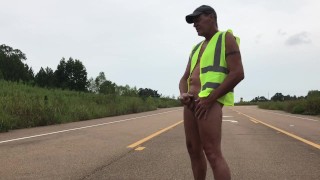 Construction worker in middle of road naked and jacking off. Eats own cum.