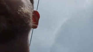 Stripping naked in a field