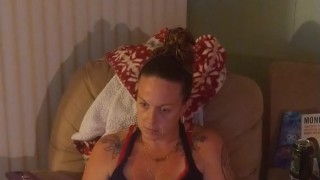 Beautiful girl in black mini dress lifts up her dress and play fortnite while smoking cigarettes