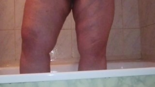 I caught my stepmom in the shower washing and massaging her big ass and her chubby shaved pussy