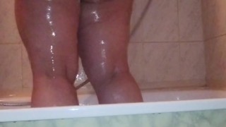 I caught my stepmom in the shower washing and massaging her big ass and her chubby shaved pussy