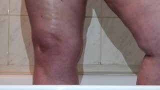 I caught a chubby mom playing with her fat pussy in the shower