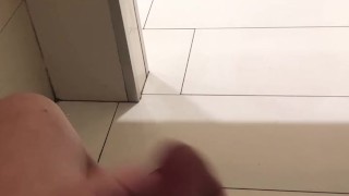 trying not to get caught jerking off in a busy public bathroom