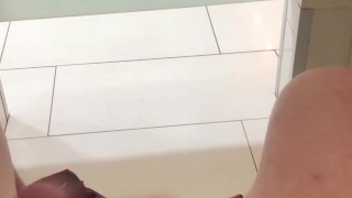 trying not to get caught jerking off in a busy public bathroom