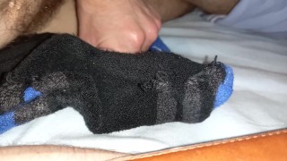 Twink cumming a big load onto some sports socks after gym
